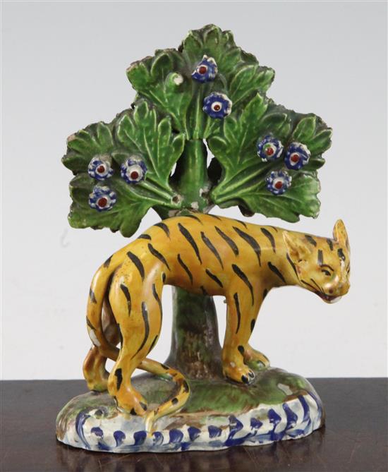 An early 19th century Staffordshire pearlware figure of an arched tiger, 13.5cm, damages